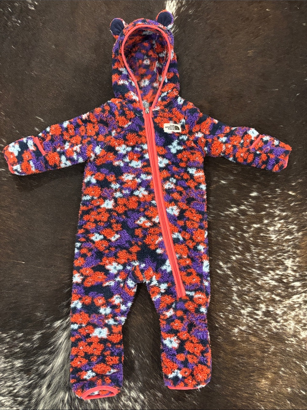 The North Face Plush Hooded One-Piece in Purple, Red & Light Blue